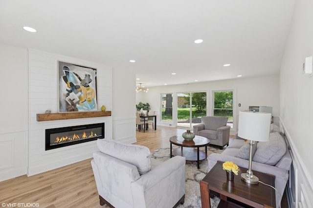 20534 Arcadian Dr, Olympia Fields, IL 60461 - living room with light wood finished floors, a glass covered fireplace, and recessed lighting