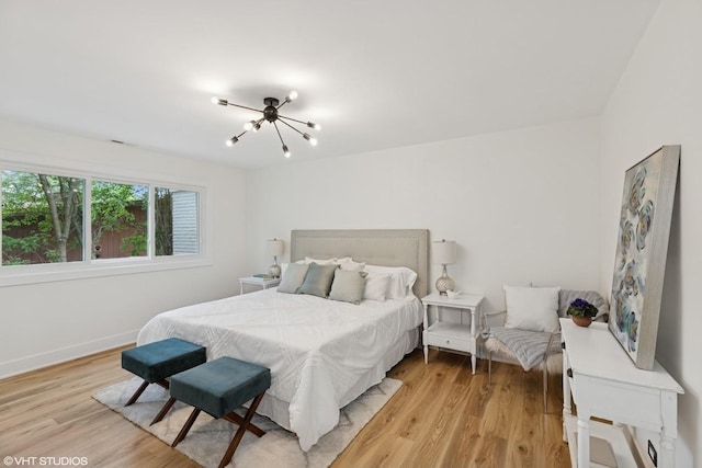 20534 Arcadian Dr, Olympia Fields, IL 60461 - bedroom with a chandelier, light wood-style flooring, and baseboards