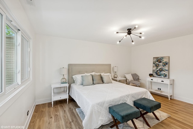 20534 Arcadian Dr, Olympia Fields, IL 60461 - bedroom featuring light wood finished floors, baseboards, and a chandelier
