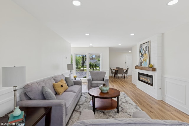 20534 Arcadian Dr, Olympia Fields, IL 60461 - living area with light wood finished floors, recessed lighting, wainscoting, and a large fireplace