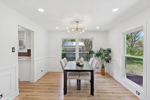 20534 Arcadian Dr, Olympia Fields, IL 60461 - dining space featuring a chandelier, a decorative wall, wainscoting, light wood finished floors, and recessed lighting