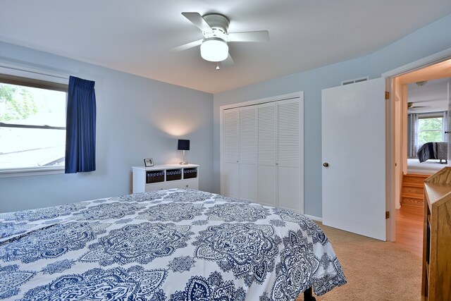 537 S Echo Ln, Palatine, IL 60067 - bedroom featuring a closet, light carpet, and a ceiling fan