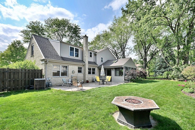 537 S Echo Ln, Palatine, IL 60067 - back of house with a patio area, a chimney, brick siding, a shingled roof, and a fire pit