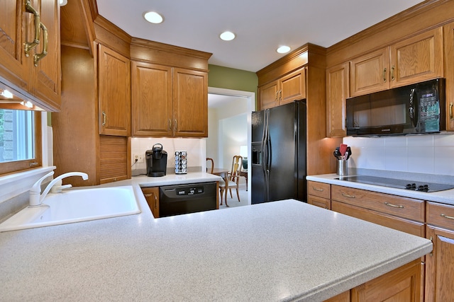 537 S Echo Ln, Palatine, IL 60067 - kitchen with black appliances, backsplash, light countertops, brown cabinets, and recessed lighting