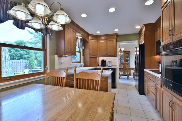537 S Echo Ln, Palatine, IL 60067 - kitchen featuring wall oven, light countertops, healthy amount of natural light, light tile patterned floors, and recessed lighting