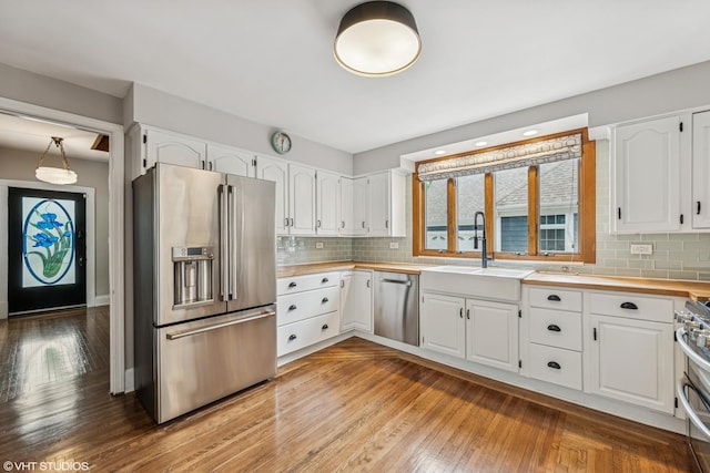 408 W Campbell St, Arlington Heights, IL 60005 - kitchen with appliances with stainless steel finishes, white cabinetry, and tasteful backsplash