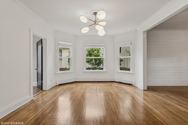 408 W Campbell St, Arlington Heights, IL 60005 - unfurnished dining area with a chandelier, wood-type flooring, and crown molding