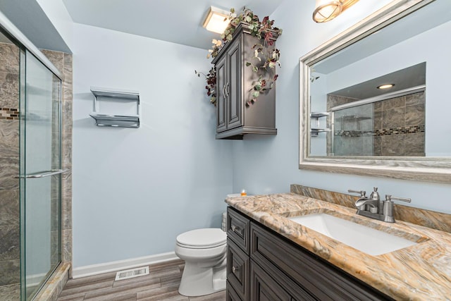 1440 Monarch Cir, Naperville, IL 60564 - full bathroom with vanity, a stall shower, toilet, and wood finished floors