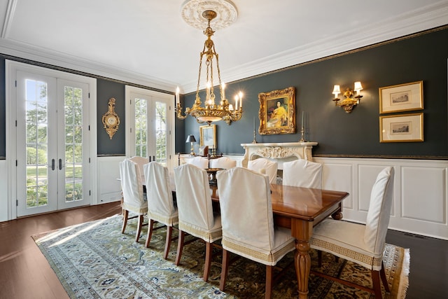 15W120 60th St, Burr Ridge, IL 60527 - dining space with french doors, crown molding, a decorative wall, wainscoting, and a chandelier
