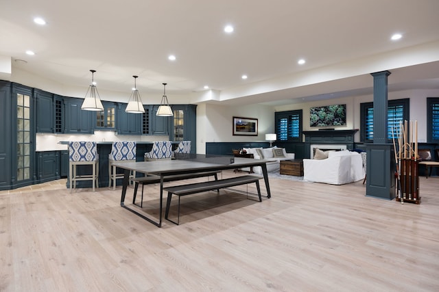 15W120 60th St, Burr Ridge, IL 60527 - rec room featuring light wood-style floors, recessed lighting, decorative columns, and a fireplace