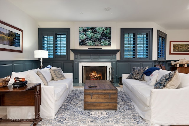 15W120 60th St, Burr Ridge, IL 60527 - living room featuring a fireplace, a decorative wall, and a wainscoted wall