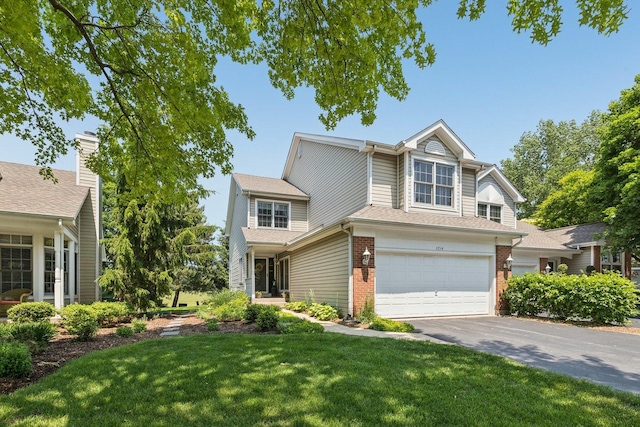 1714 Waverly Cir, Saint Charles, IL 60174 - view of front of house featuring brick siding, driveway, a garage, and a front yard