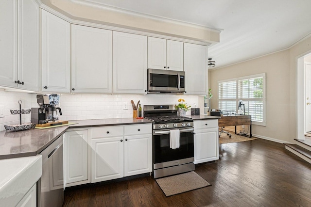 1714 Waverly Cir, Saint Charles, IL 60174 - kitchen featuring appliances with stainless steel finishes, tasteful backsplash, dark wood finished floors, and ornamental molding