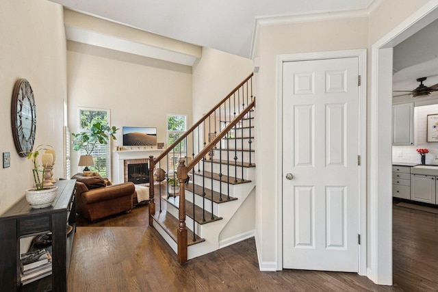 1714 Waverly Cir, Saint Charles, IL 60174 - stairs featuring wood finished floors, a brick fireplace, and a ceiling fan