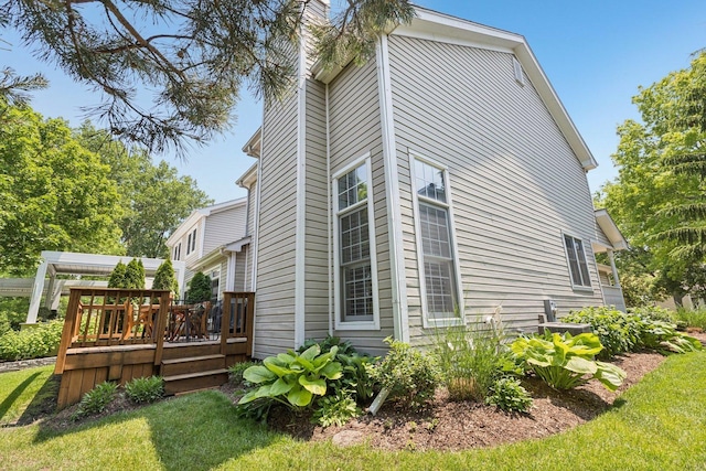 1714 Waverly Cir, Saint Charles, IL 60174 - view of property exterior with a wooden deck, a chimney, and a yard
