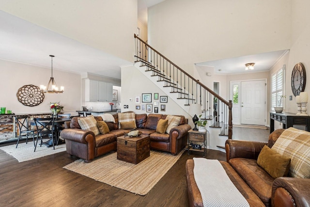 1714 Waverly Cir, Saint Charles, IL 60174 - living area with dark wood-style flooring, stairway, a chandelier, a towering ceiling, and crown molding