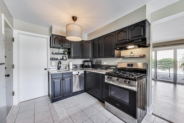 6468 N NW Hwy Unit A1, Chicago, IL 60631 - kitchen with appliances with stainless steel finishes, under cabinet range hood, open shelves, and light tile patterned flooring