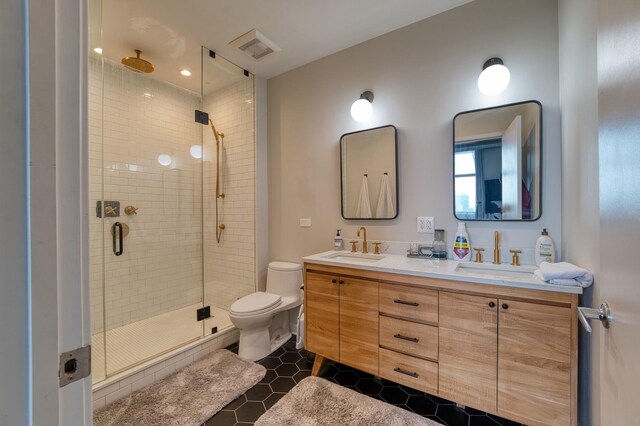 700 N Larrabee St Unit 1315, Chicago, IL 60654 - full bath with double vanity, a shower stall, toilet, and tile patterned floors