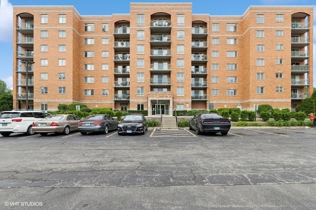6807 N Milwaukee Ave Unit 708, Niles, IL 60714 - view of apartment building / complex featuring uncovered parking