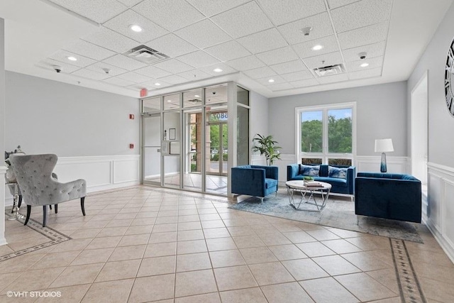 6807 N Milwaukee Ave Unit 708, Niles, IL 60714 - lobby with a paneled ceiling, a decorative wall, wainscoting, recessed lighting, and a security system