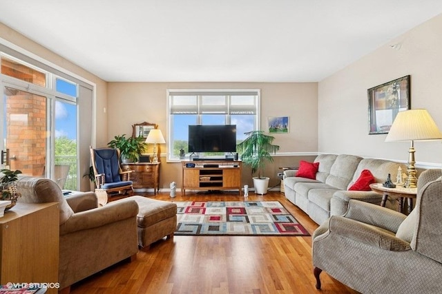 6807 N Milwaukee Ave Unit 708, Niles, IL 60714 - living area featuring healthy amount of natural light and wood finished floors