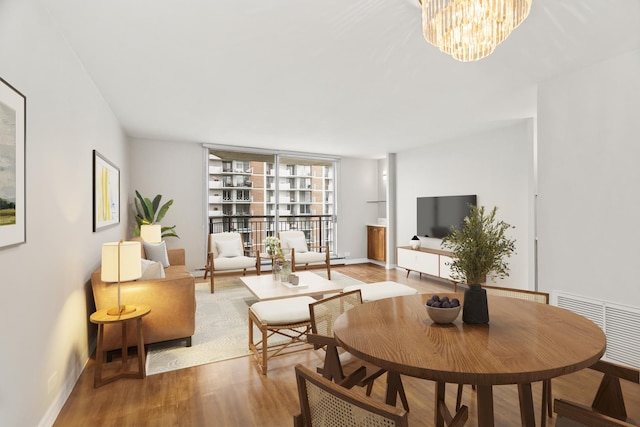 6007 N Sheridan Rd Unit 37H, Chicago, IL 60660 - living area with wood finished floors, a chandelier, and baseboards