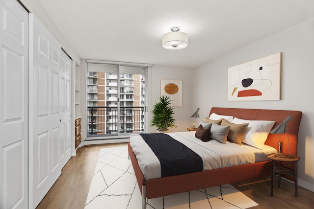 6007 N Sheridan Rd Unit 37H, Chicago, IL 60660 - bedroom featuring wood finished floors and a closet