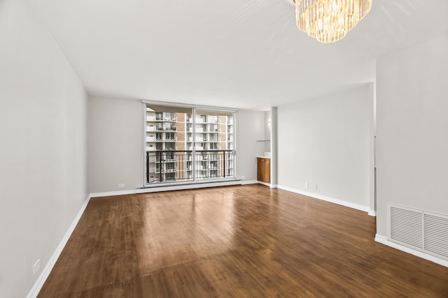 6007 N Sheridan Rd Unit 37H, Chicago, IL 60660 - unfurnished living room featuring wood finished floors, a chandelier, and baseboards