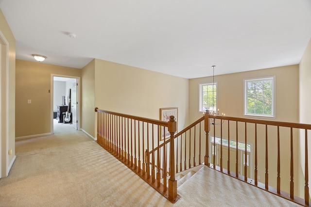 16266 W Mohawk Ct, Lockport, IL 60441 - hall featuring an upstairs landing, carpet floors, and a chandelier