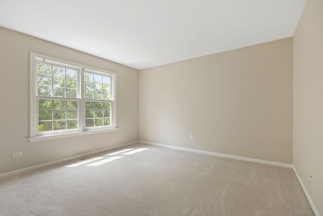 16266 W Mohawk Ct, Lockport, IL 60441 - spare room featuring light carpet and baseboards