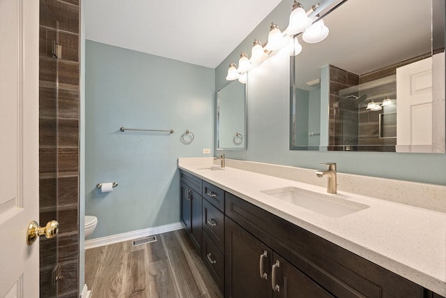 16266 W Mohawk Ct, Lockport, IL 60441 - full bath featuring double vanity, a tile shower, and wood finished floors