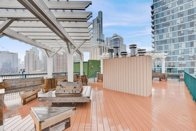 1322 S Wabash Ave Unit 407, Chicago, IL 60605 - wooden deck with a skyline view and a pergola