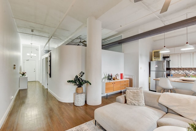 1322 S Wabash Ave Unit 407, Chicago, IL 60605 - living area featuring wood finished floors, a ceiling fan, and a chandelier