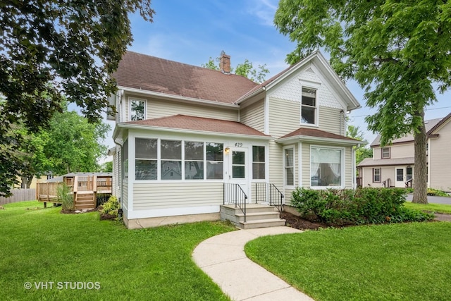 429 W Pierce St, Elburn, IL 60119 - victorian house with a wooden deck, a front yard, a chimney, and a shingled roof
