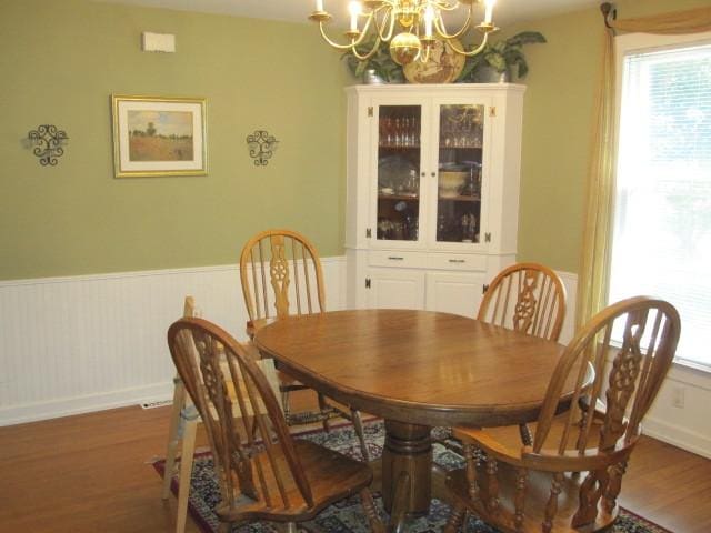 429 W Pierce St, Elburn, IL 60119 - dining space with a chandelier, wood finished floors, and wainscoting