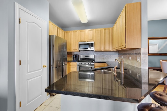 1259 W Lake St Unit 304, Addison, IL 60101 - kitchen with appliances with stainless steel finishes, a peninsula, light brown cabinetry, decorative backsplash, and light tile patterned floors