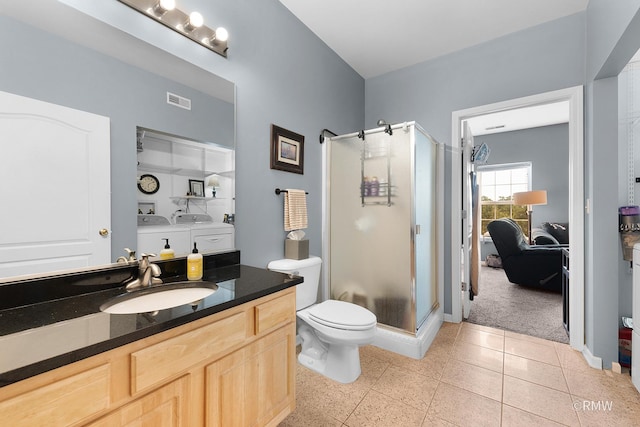 1259 W Lake St Unit 304, Addison, IL 60101 - bathroom featuring a stall shower, vanity, and washer and dryer