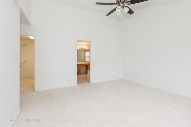 1110 Oakhill Dr, Aurora, IL 60502 - unfurnished room featuring light colored carpet, ceiling fan, and baseboards