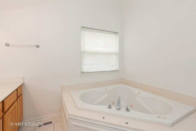 1110 Oakhill Dr, Aurora, IL 60502 - bathroom featuring a tub with jets, vanity, and tile patterned flooring