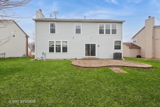 1110 Oakhill Dr, Aurora, IL 60502 - rear view of property with central AC unit, a yard, a patio area, and a chimney