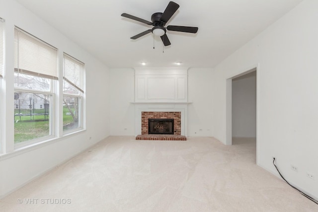 1110 Oakhill Dr, Aurora, IL 60502 - unfurnished living room with carpet, ceiling fan, and a fireplace