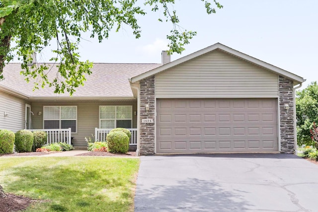 1424 Crimson Ridge Dr, Byron, IL 61010 - ranch-style house with stone siding, a chimney, asphalt driveway, a garage, and a front yard