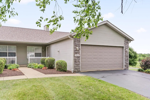 1424 Crimson Ridge Dr, Byron, IL 61010 - view of front of house featuring stone siding, driveway, an attached garage, a chimney, and a front lawn