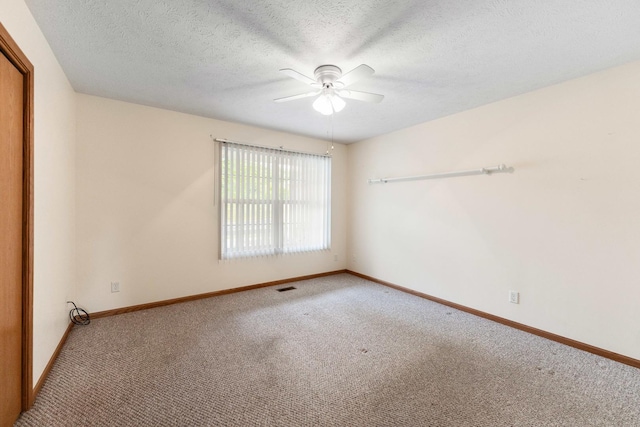 1424 Crimson Ridge Dr, Byron, IL 61010 - spare room with carpet floors, ceiling fan, and a textured ceiling