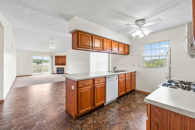 1424 Crimson Ridge Dr, Byron, IL 61010 - kitchen featuring ceiling fan, white appliances, brown cabinets, a textured ceiling, and light countertops