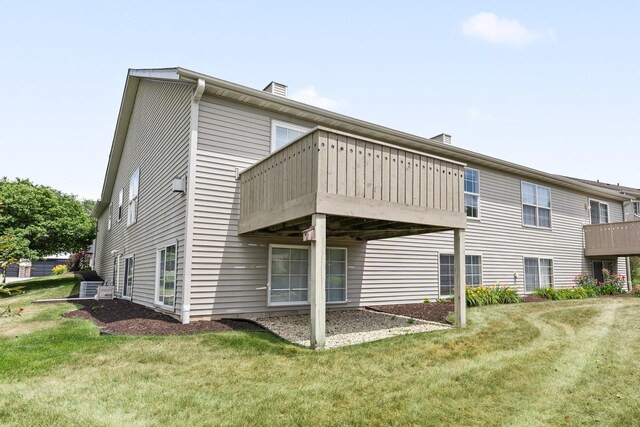 1424 Crimson Ridge Dr, Byron, IL 61010 - rear view of property featuring a yard and a chimney