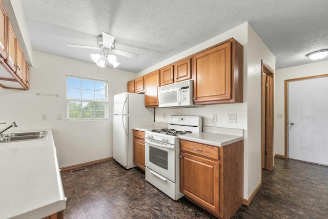 1424 Crimson Ridge Dr, Byron, IL 61010 - kitchen featuring white appliances, ceiling fan, a textured ceiling, brown cabinets, and light countertops
