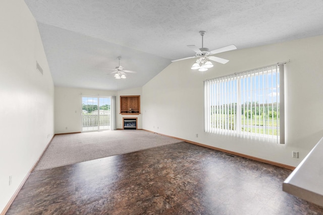1424 Crimson Ridge Dr, Byron, IL 61010 - unfurnished living room with ceiling fan, vaulted ceiling, and a fireplace