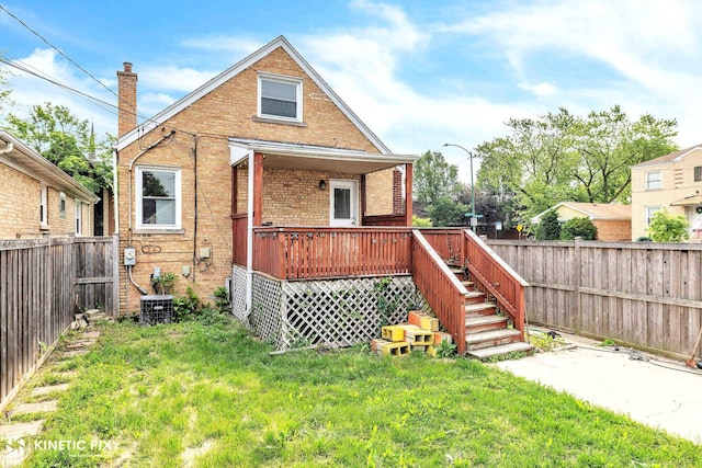 3600 N New England Ave, Chicago, IL 60634 - back of property with brick siding, a wooden deck, and a chimney