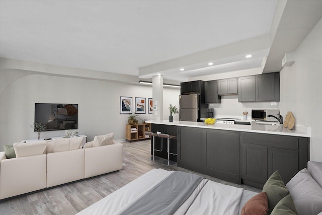 300 N State St Unit 5225, Chicago, IL 60654 - living area featuring light wood finished floors and recessed lighting
